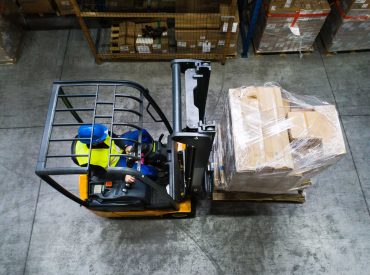 warehouse-man-worker-with-forklift-PR3WQUR.jpg